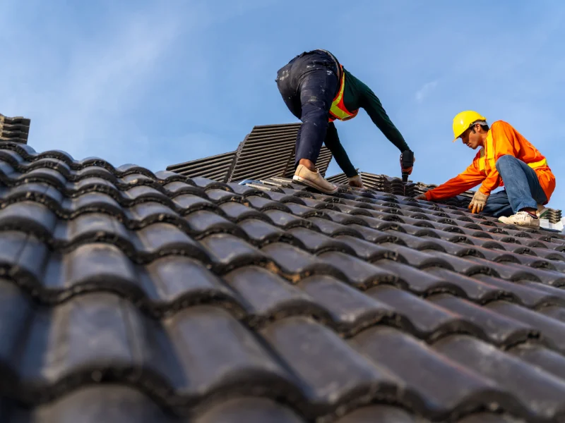 An image showing Spartan Roofing & Siding experts working on a roof replacement in San Antonio, TX.