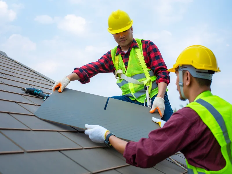 An image showing Spartan Roofing & Siding experts install a commercial roof in San Antonio, TX.