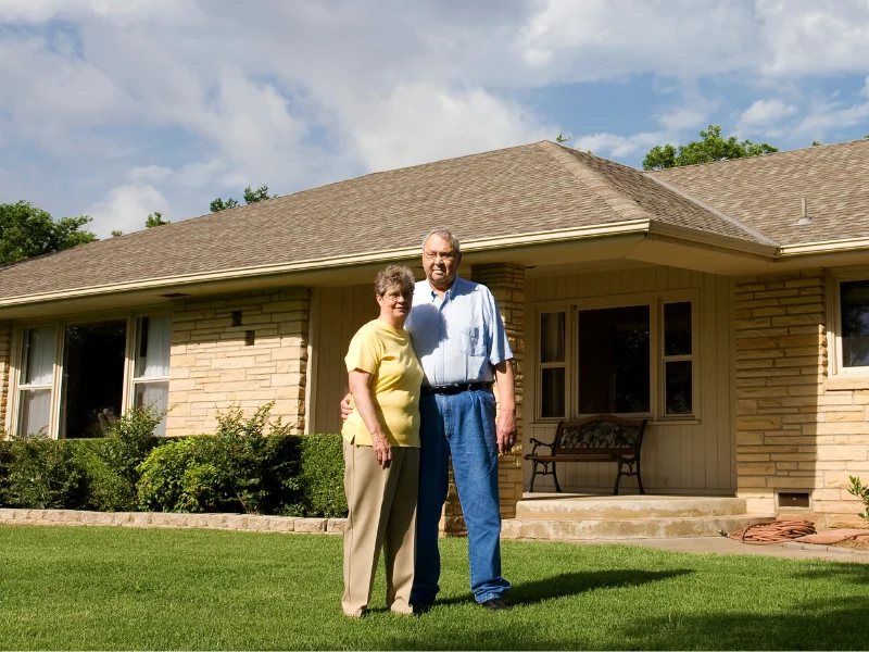 An image of satisfied homeowners after roofing service in San Antonio provided by Spartan Roofing & Siding.