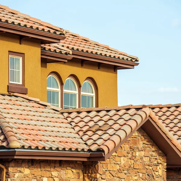 An image showing different types of tile roofs including clay, concrete, and synthetic options.